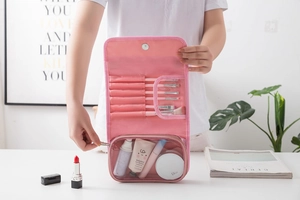 Pink travel cosmetic bag with folding compartments and transparent PVC storage zipper pockets