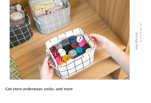Foldable cotton linen storage basket in wardrobe organizing socks and underwear