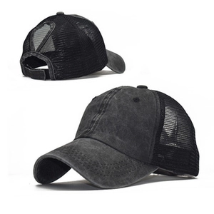 Detail view of washed cotton baseball cap with ponytail hole and breathable mesh panels