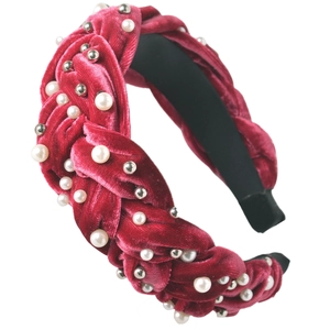 Braided red velvet headband with white pearls and silver studs on white background