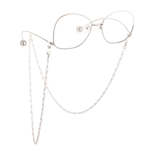 Detail of white pearl glasses chain with silver alloy links and non-slip rubber loops