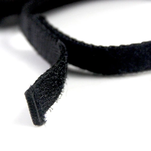 Close-up of the black nylon Velcro fastener for a pet bat wing costume detail