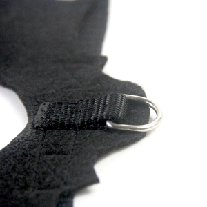 Detailed close-up of a sturdy metal D-ring on a black felt Halloween bat wing for pets