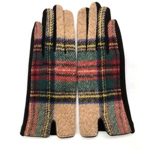 Close-up of multicolor tartan wool fabric gloves with solid black side paneling