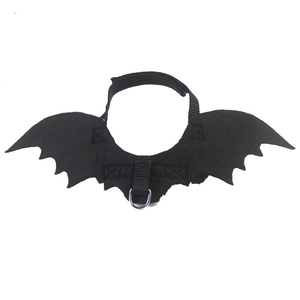 Detail of black felt bat wings with adjustable nylon straps and a metal D-ring for pets