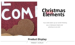 Close-up of red Christmas welcome mat with festive plush reindeer accent details