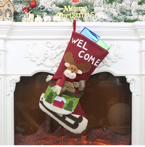 Close-up of a festive red Christmas stocking with a reindeer design and Welcome text