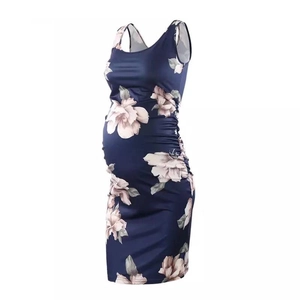 Navy floral sleeveless maternity dress with side ruching shown from a 45-degree angle