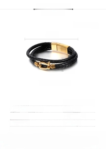 Macro detail of triple-layer black leather bracelet with gold stainless steel clasp