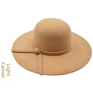 Detail view of the light camel wide brim wool fedora hat with matching ribbon trim