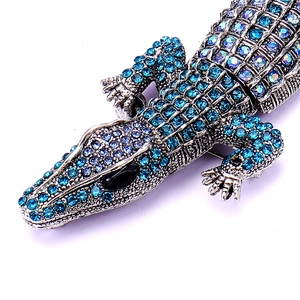 Sparkling blue rhinestone crocodile brooch crafted in silver-plated metal for unisex fashion