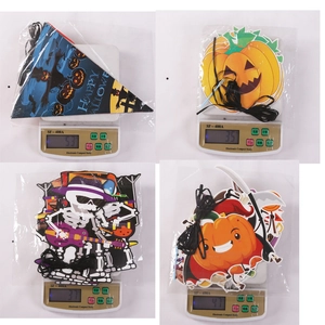Detailed weights of Halloween banner decorations on a digital scale for party supplies