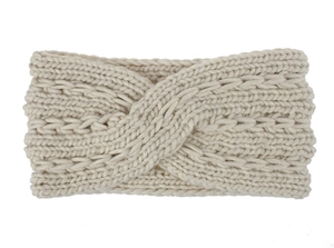 Detailed texture of chunky knit twist headband in cream soft acrylic yarn finish