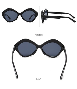 Front and side view of black irregular geometric sunglasses with dark grey lenses