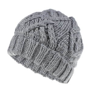 Close-up of the thick cable knit texture on a gray winter beanie for women