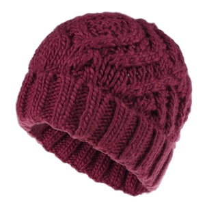 Close-up of thick wine red knit beanie showing detailed diamond cable stitch texture