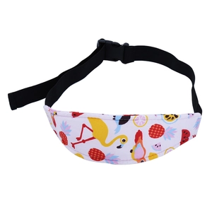 Detail of adjustable toddler car seat head support belt with cartoon flamingo prints