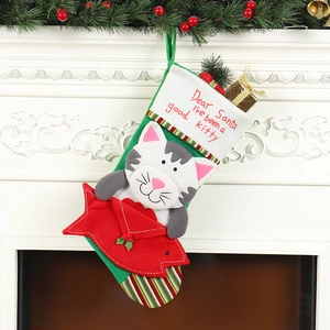 Christmas cat stocking with 'Dear Santa I've been a good kitty' embroidery on fireplace
