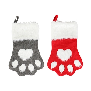 Set of two dog paw Christmas stockings in red and grey with plush white faux fur trim