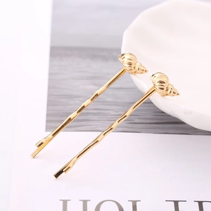 Golden sea shell and conch hair clip set with minimalist ocean theme hairpins