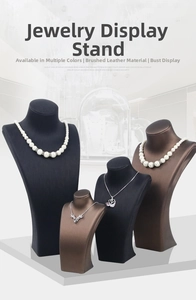 Detailed close-up of vertical necklace busts in black and brown brushed faux leather