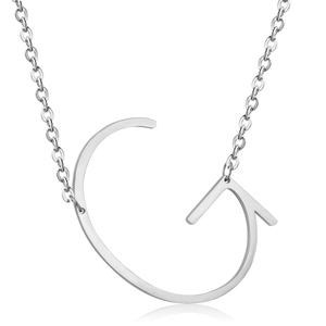 Macro shot of silver stainless steel pendant featuring a large capital letter G design