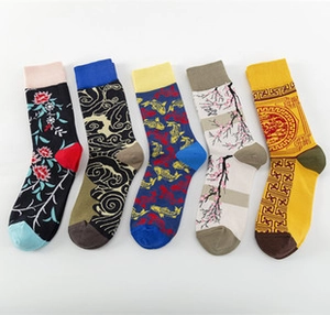 Detailed view of five cotton mid-calf socks with traditional floral and cloud patterns