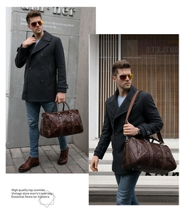 Detail of vintage top cowhide leather travel bag with diamond quilted pattern on street