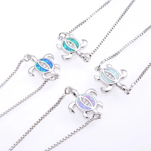 Set of four silver turtle bracelets with colorful opal stones and sparkling zircon stones
