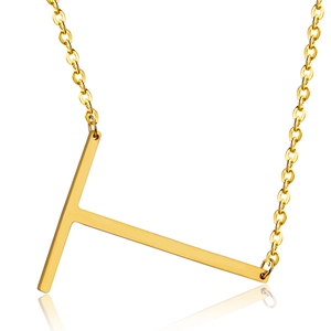 Macro detail of polished 18K gold-plated stainless steel letter T pendant necklace