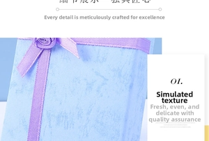 Close-up of light blue jewelry box with purple ribbon and faux marble texture finish