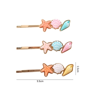 Set of 3 ocean-themed hair clips with starfish, shell, and conch designs in pastel gradients