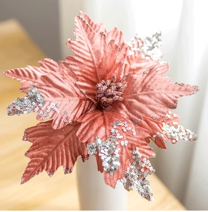 Close-up of a 25cm pink velvet artificial Christmas flower with silver sequins and glitter