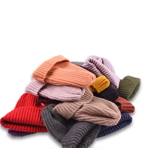 Minimalist knit beanie hats in multiple colors with elastic ribbed design for warmth