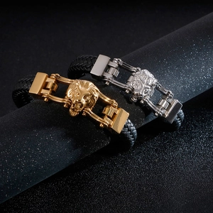 Men's leather bracelet with lion head clasp in gold and silver finish on black woven band