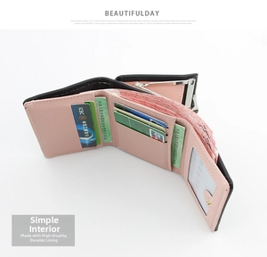 Detailed interior of women's tri-fold wallet showing card slots and pink lining