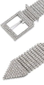 Detailed close-up of wide multi-row rhinestone waist belt buckle and crystal-encrusted tip