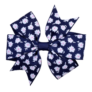 Dark blue grosgrain bow hair clip for girls with white daisy and pink floral dot prints