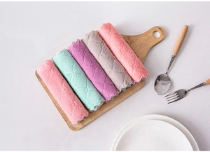 Close-up of five colorful microfiber kitchen towels with diamond texture on a wooden tray