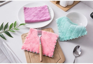 Close-up of pastel microfibre dishcloths with diamond texture on kitchen counter