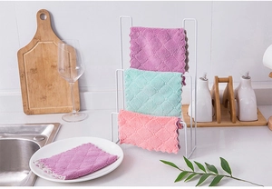Thick microfiber dishcloths with wave edges and storage rack in a modern kitchen setting