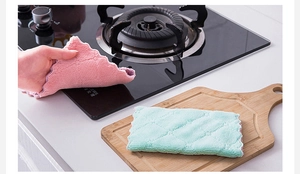 Pink and green microfiber dishcloths with wave edges and diamond quilted texture