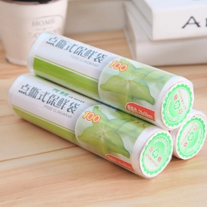 Three rolls of 20x30cm food-grade PE plastic bags for food preservation on wood table