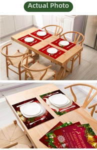 Detailed close-up of red Christmas placemats with bells and snowflakes on a wooden table