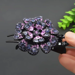 Close-up of blue and purple floral rhinestone duckbill hair clip with metal teeth