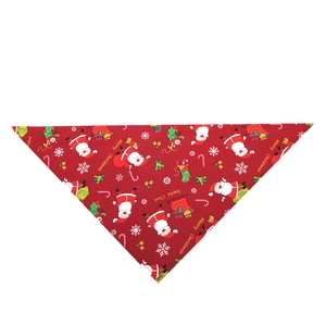 Detail of red Christmas pet bandana featuring Santa Claus and snowflake prints