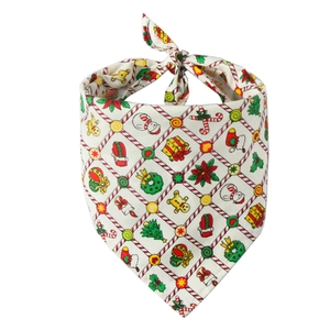 Detailed view of Christmas pet bandana with snowman and tree pattern print