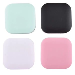 Matte square contact lens cases in mint, black, white, and pink minimalist design