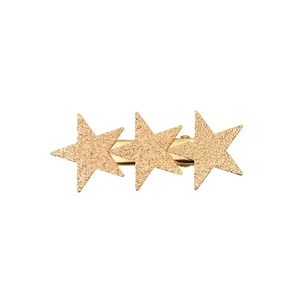 Close-up of golden metal hair clip with three glittery star charms on white background