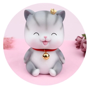 Cute gray striped cat piggy bank with gold crown and bell for home decoration
